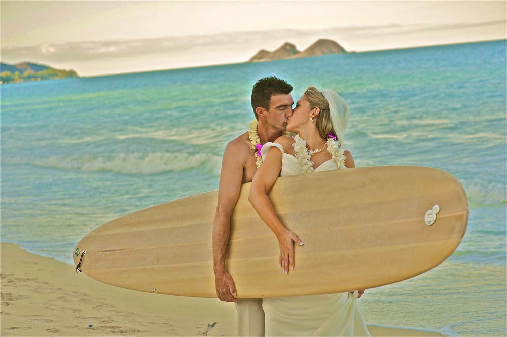 holding surfboard after the wedding with Leigh and troy